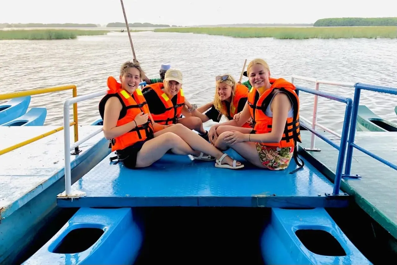 Group of friends on a lagoon boat trip