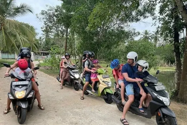 Tourists on a group scooter tour