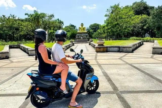Couple exploring by rented scooter